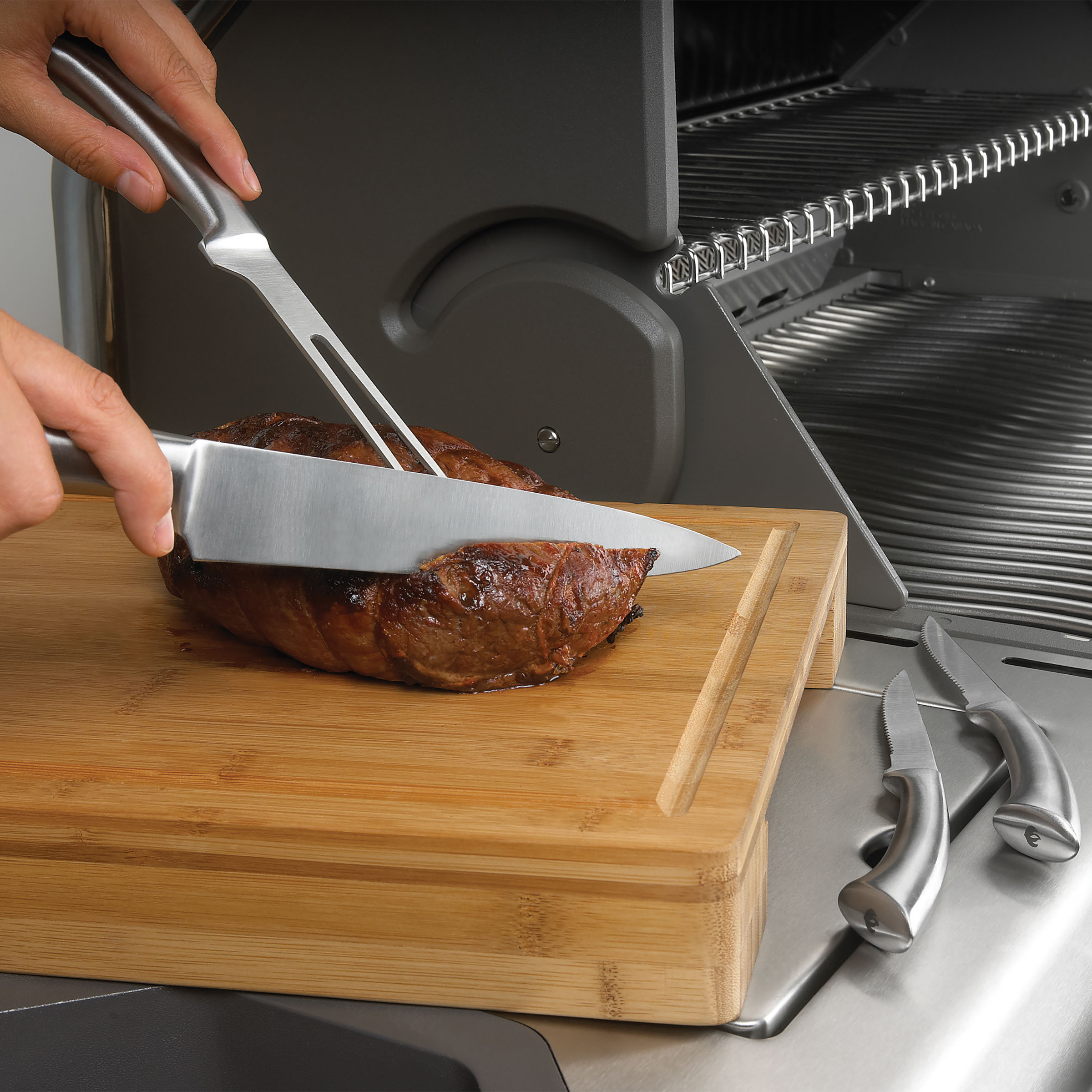 55206-knife-set-cutting-board-in-use-napoleon-grills